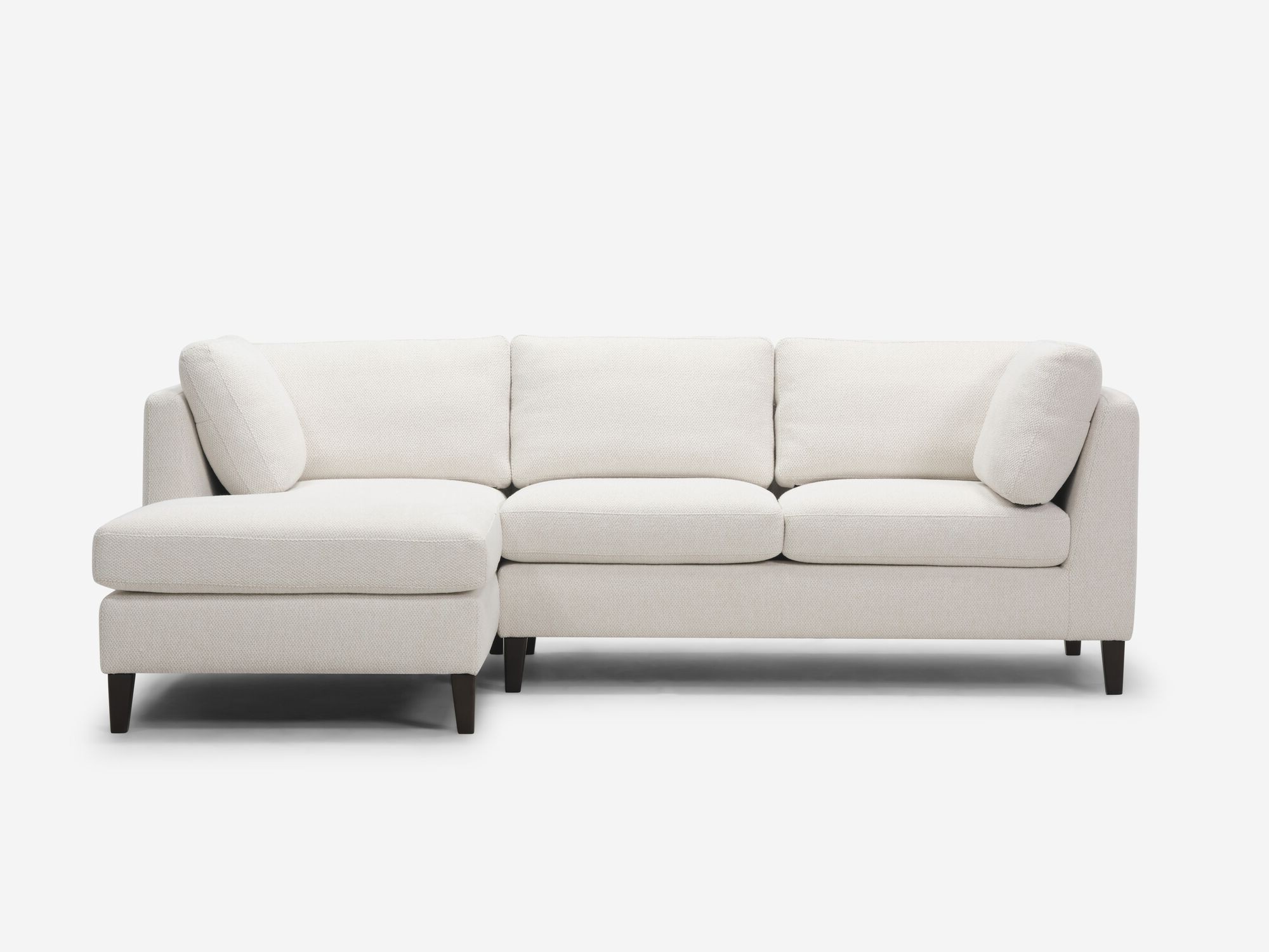 Front view of the Salema modular sofa in grey fabric with left hand chaise